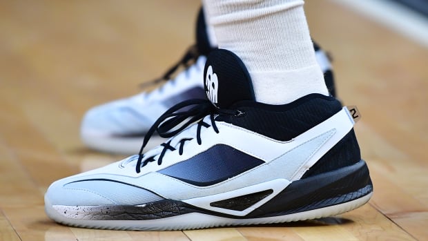 View of Kawhi Leonard's black and white New Balance shoes.